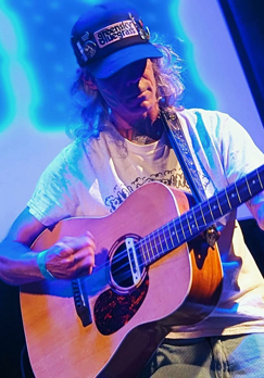 Image of Daniel Staggs a musician playing his guitar